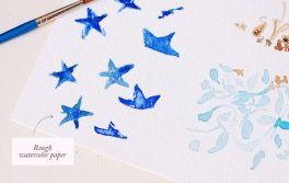 Blue stars watercolor painting on rough paper